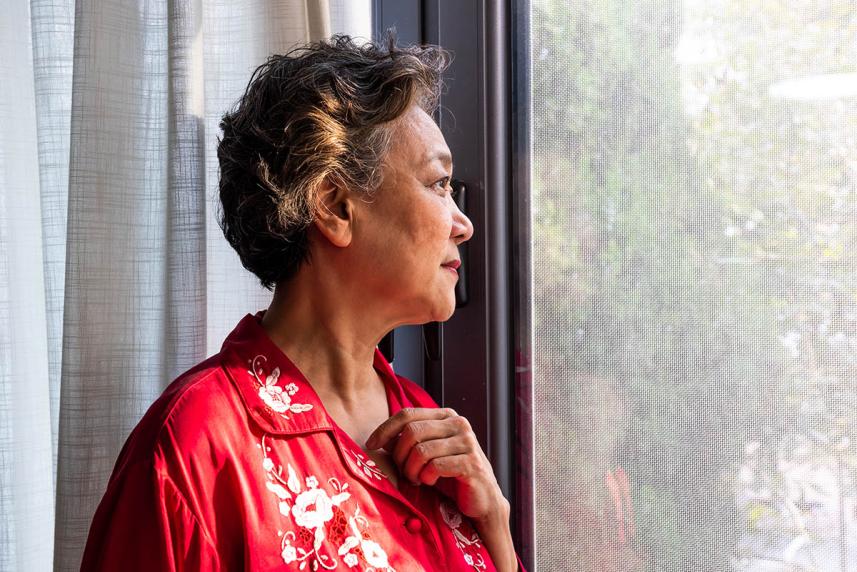 Woman looking out window