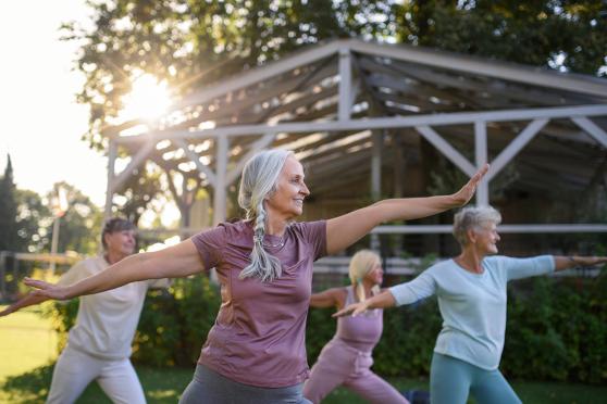 Women doing yoga outside